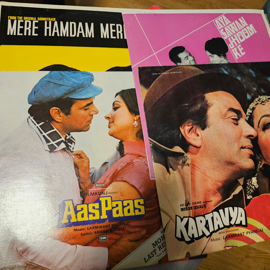 4 LPs Dharmendra's films and Laxmikant Pyarelal Superhit Aas Paas, Kartavya, Aya Sawan Jhoom ke, and Mere Hamdam Mere Dost in excellent condition